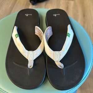 Sanuk white flip-flops with black sole size 11